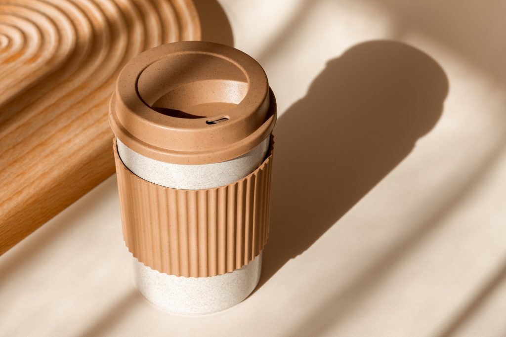 Reusable cup, biodegradable travel plastic coffee mug for take away. Sustainable bamboo eco friendly
